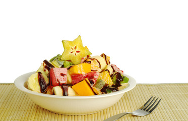 Tropical fruit salad with chocolate sauce