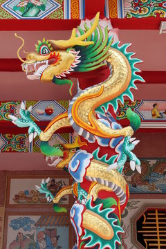 dragon statue on pillar of joss house, Borabue, Mahasarakam