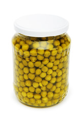 Green peas in glass jar isolated on white
