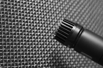 Microphone closeup against speaker