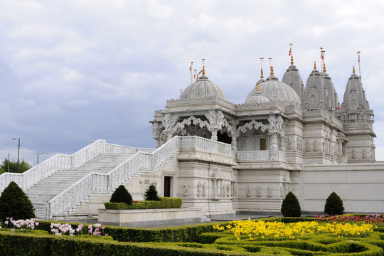 entrance and beautiful garden of hindu temple