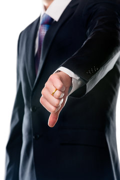 Businessman with thumb down