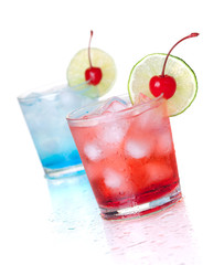 Two cocktails with lime slice and maraschino