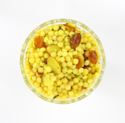 A bowl of couscous with almonds and cranberries