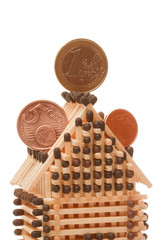 Euro coins on house
