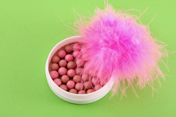 rouge on the green background