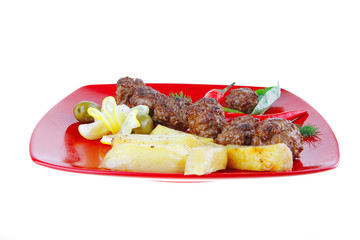 roast cutlets on red dish