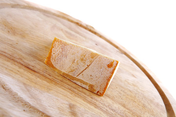light edam cheese on wood