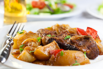 Braised pork chop with potatoes and pepper