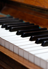 Fototapeta na wymiar old wood piano with white and black keys