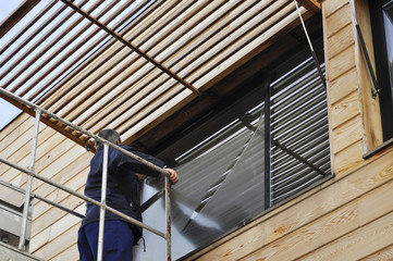 Obraz premium Laveur de vitres en nacelle 12