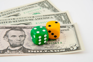dice and dollars. isolated on a white background