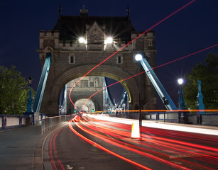 Traffic light trails in the Tower Bridge in London © kmiragaya
