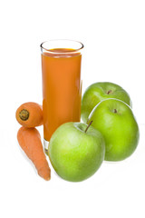 Apples, carrot and juice in glass