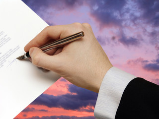 The Signature of Business Contract on the dramatically Sky