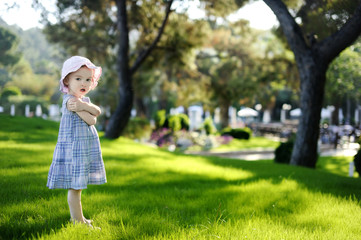 Adorable toddler girl in blue dress