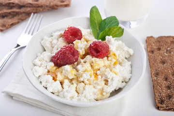 Cottage cheese breakfast with fresh raspberry
