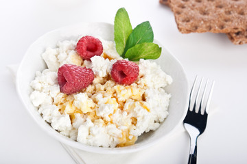 Dieting cottage cheese with fresh raspberry