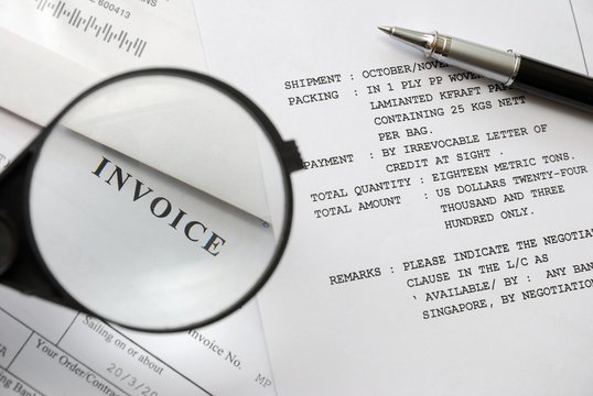 Magnifying flass on invoice