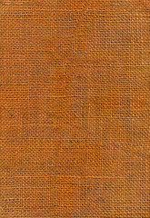Orange dyed jute canvas texture, close up
