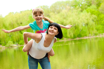 Mother playing with daughter