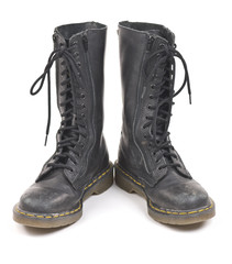 Pair of black worn old combat boots.