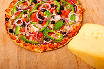 Pizza with vegetables and pepperoni