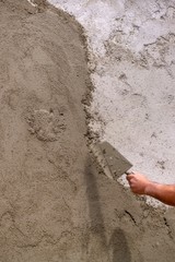 Plastering a wall outside