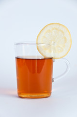 Glass of hot black tea with lemon