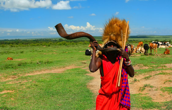 Masai warrior playing traditional horn