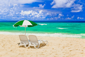 Chairs and umbrella at tropical beach