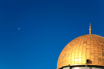 gold cupola on the background of bright blue sky