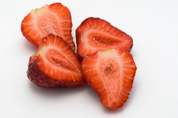 Halves strawberries on a white background