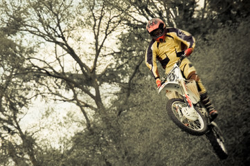 motion blur dirtbike rider in mid-air