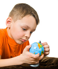 Child holding a globe on the white background