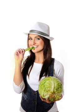 Young pretty woman with green beautiful cabbage