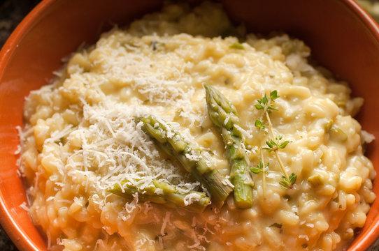 asparagus rice with parmesan cheese in bowl