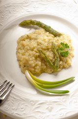asparagus rice with fork over dish