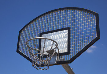 a basketball basket with blue sky