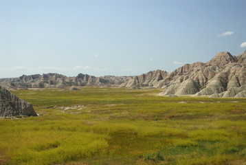 Naklejka premium Prairie meeting Badlands rock formations, Badlands NP, SD
