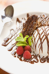 chocolate brownie with, vanilla ice cream and raspberries