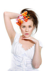 young beautiful woman posing over white