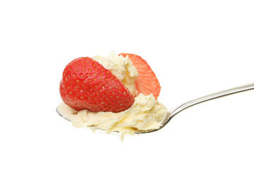 Strawberry and clotted cream in a spoon
