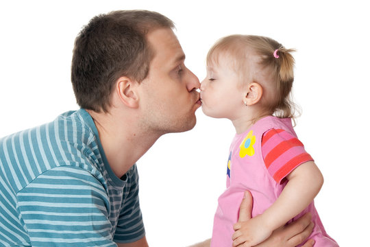little girl and her dad giving kiss