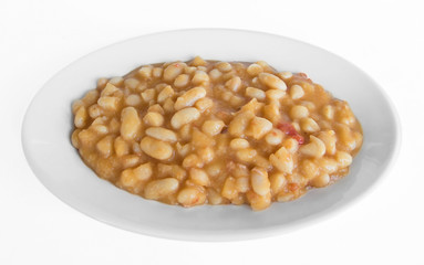 Beans soup on white dish.
