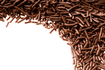chocolate sprinkles on white background