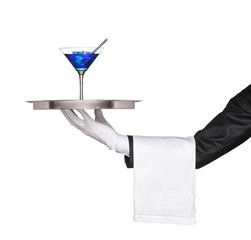 A hand holding a silver tray with a blue cocktail on it