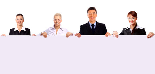 Fototapeta premium group of business people holding a banner ad isolated on white