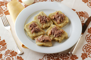 Polenta canapes with fish - Appetizer