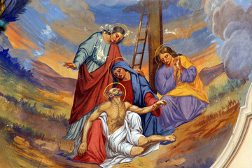 Jesus' body is removed from the cross